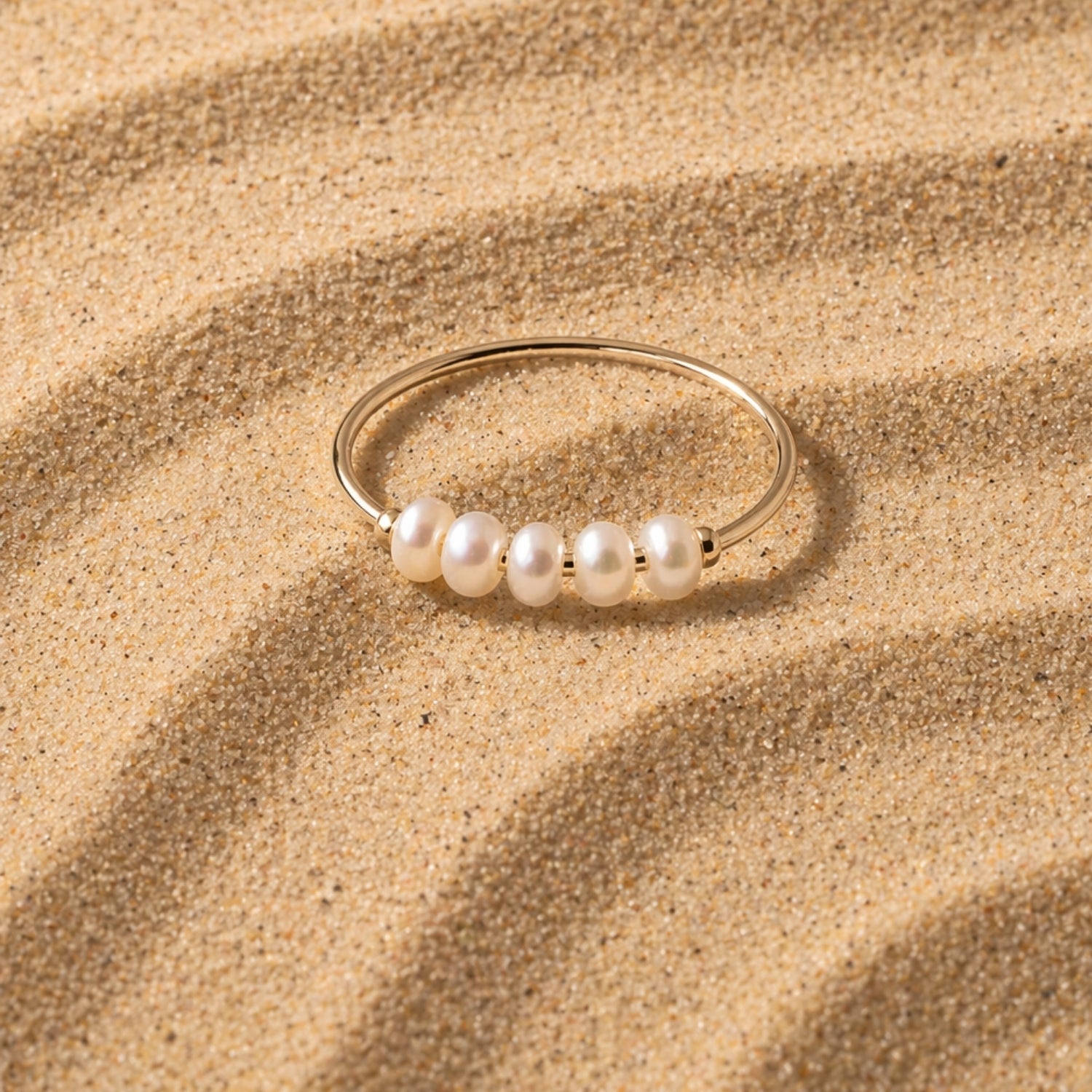 14K Mini Pearls Ring On Sand Close Up