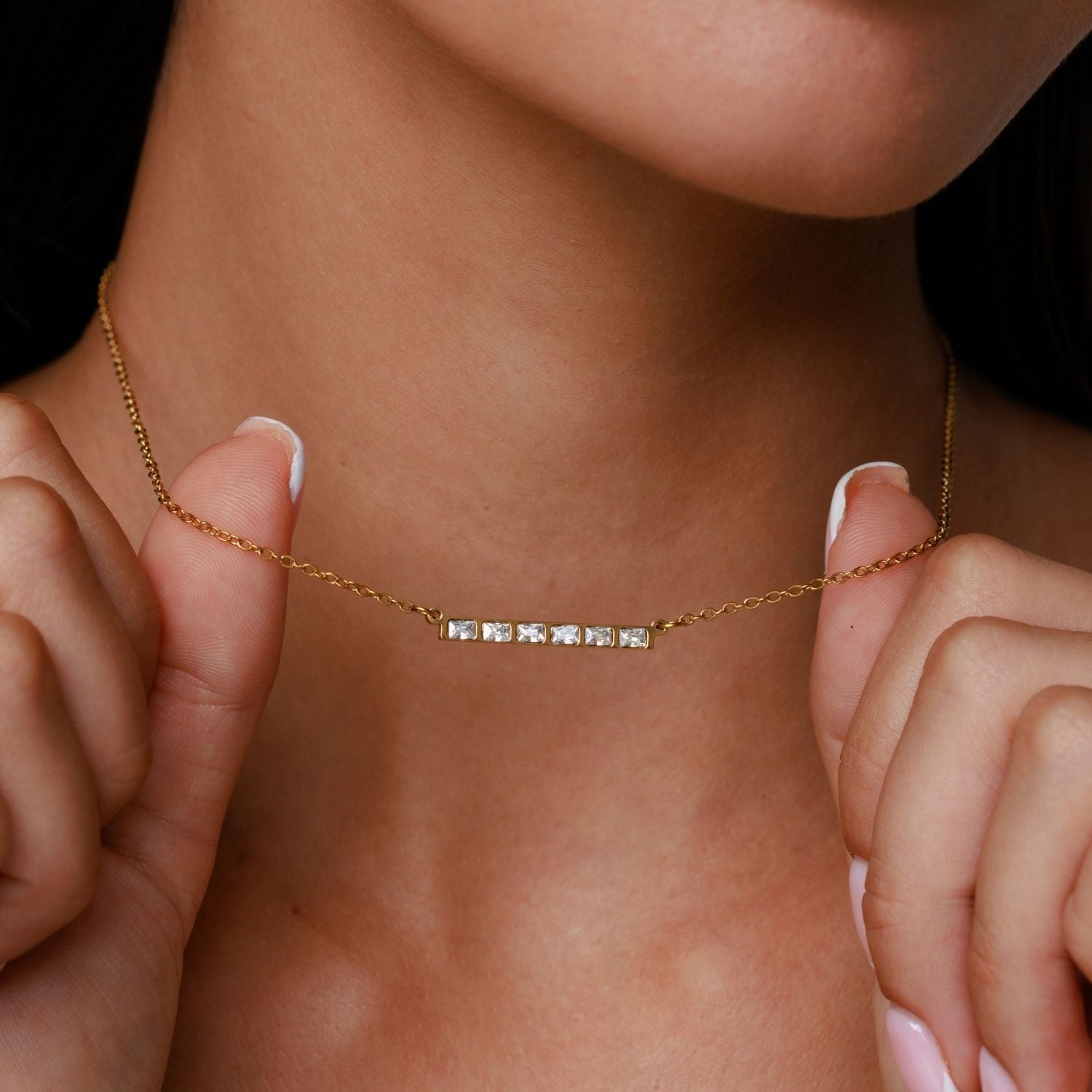 Baguette Line Necklace Held In Hands