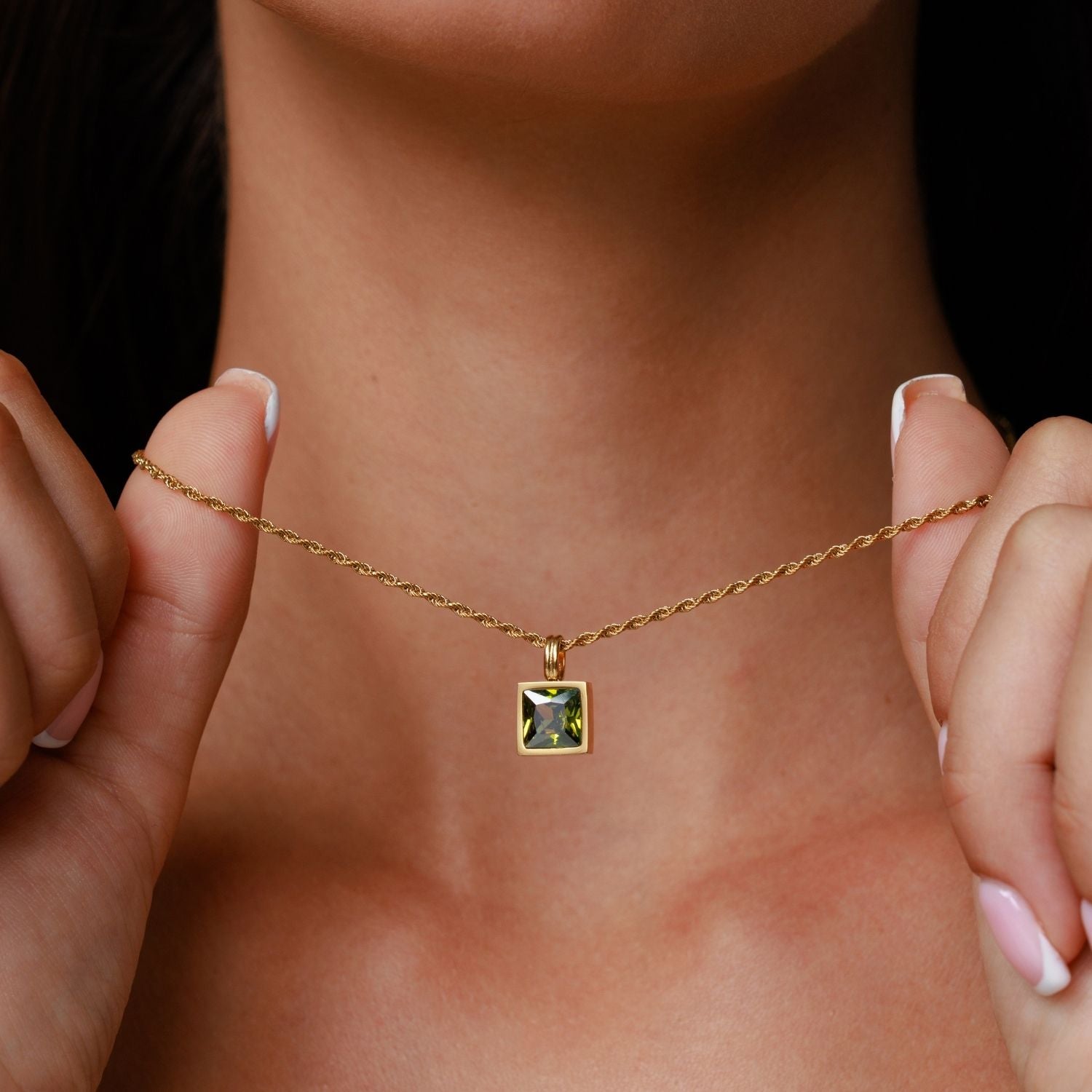 Emerald Necklace Held in Hand