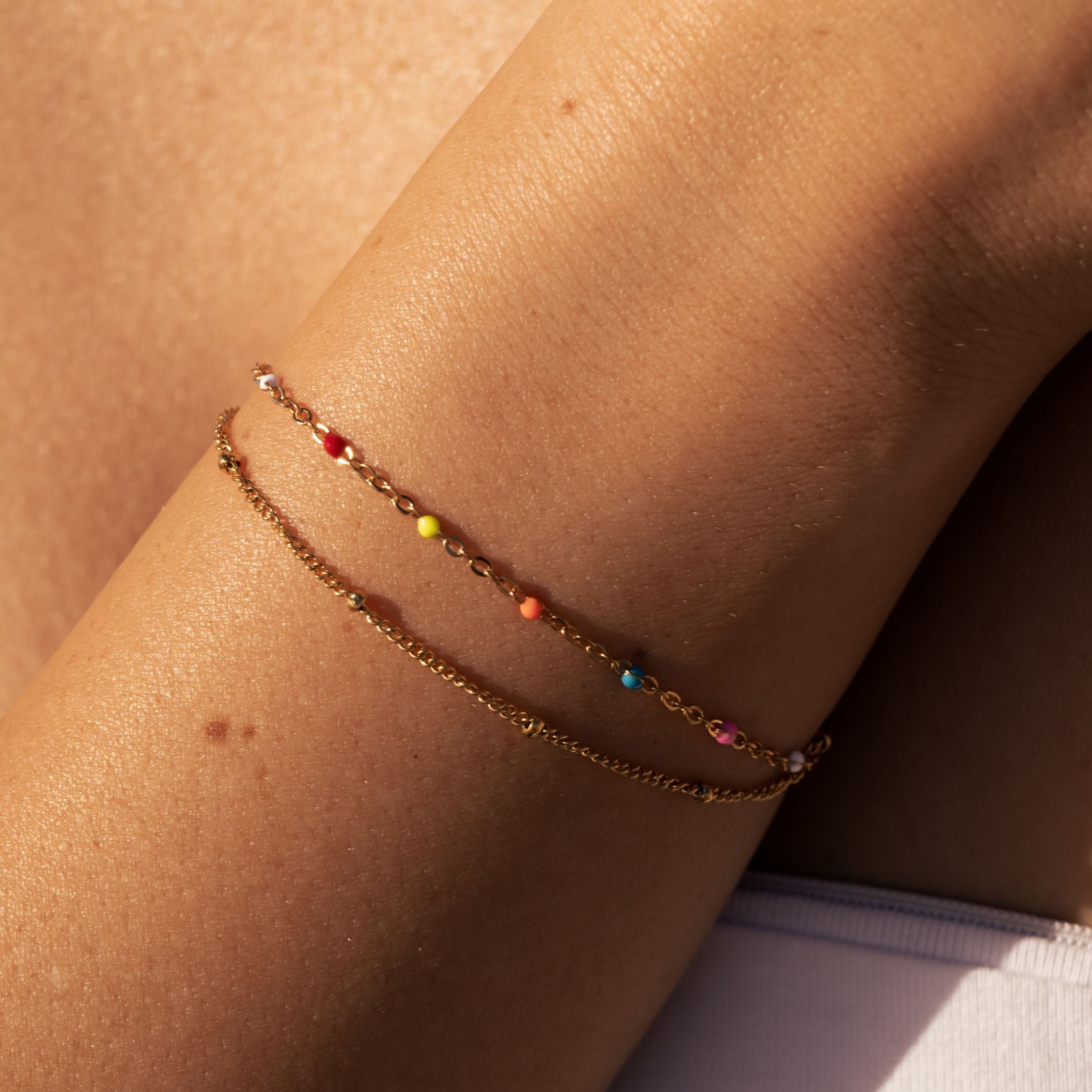 neon-bracelet-layered-on-model