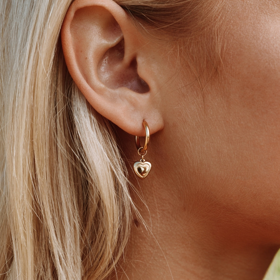 gold-heart-hoop-earrings-on-ear