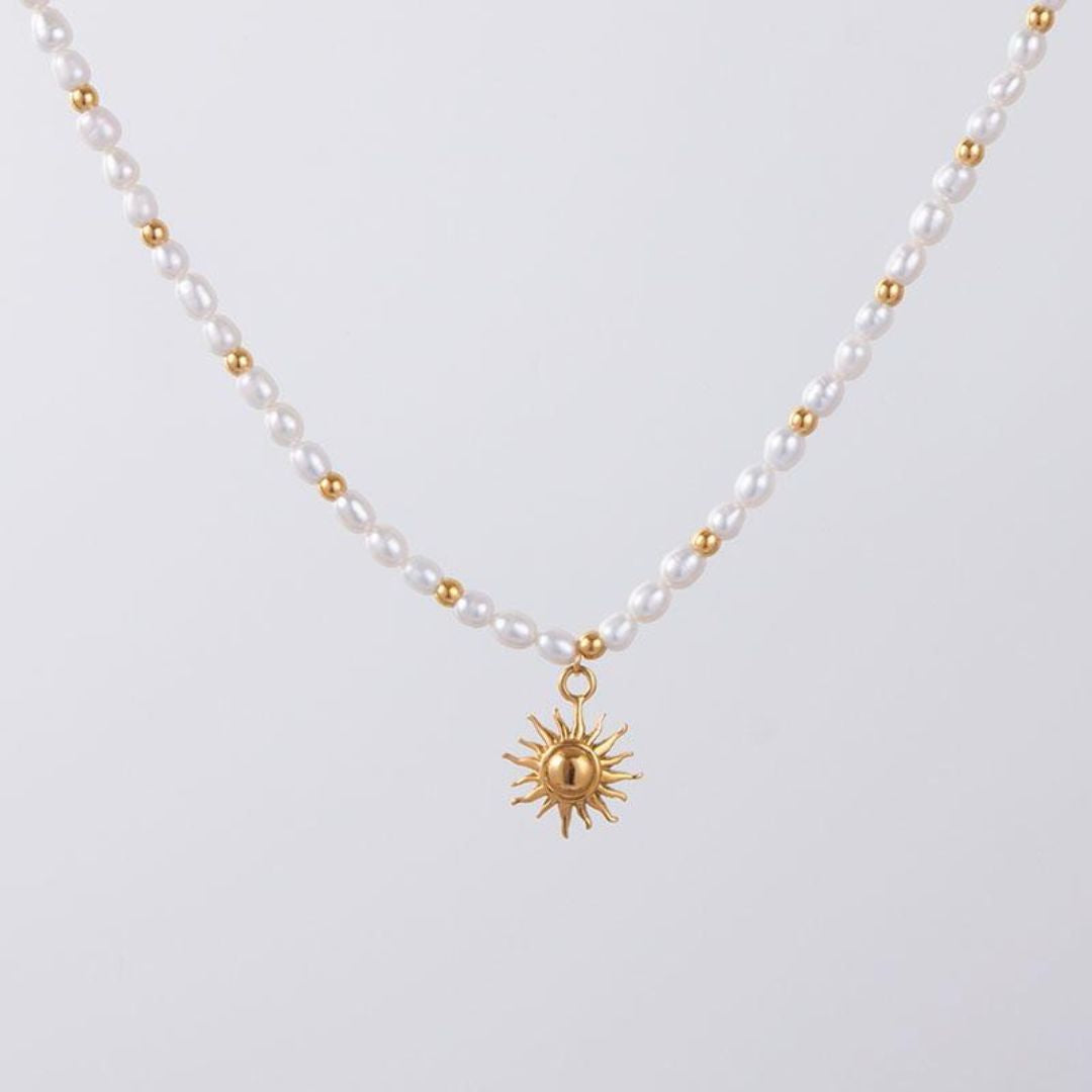 sun-pendant-gold-necklace-white-background