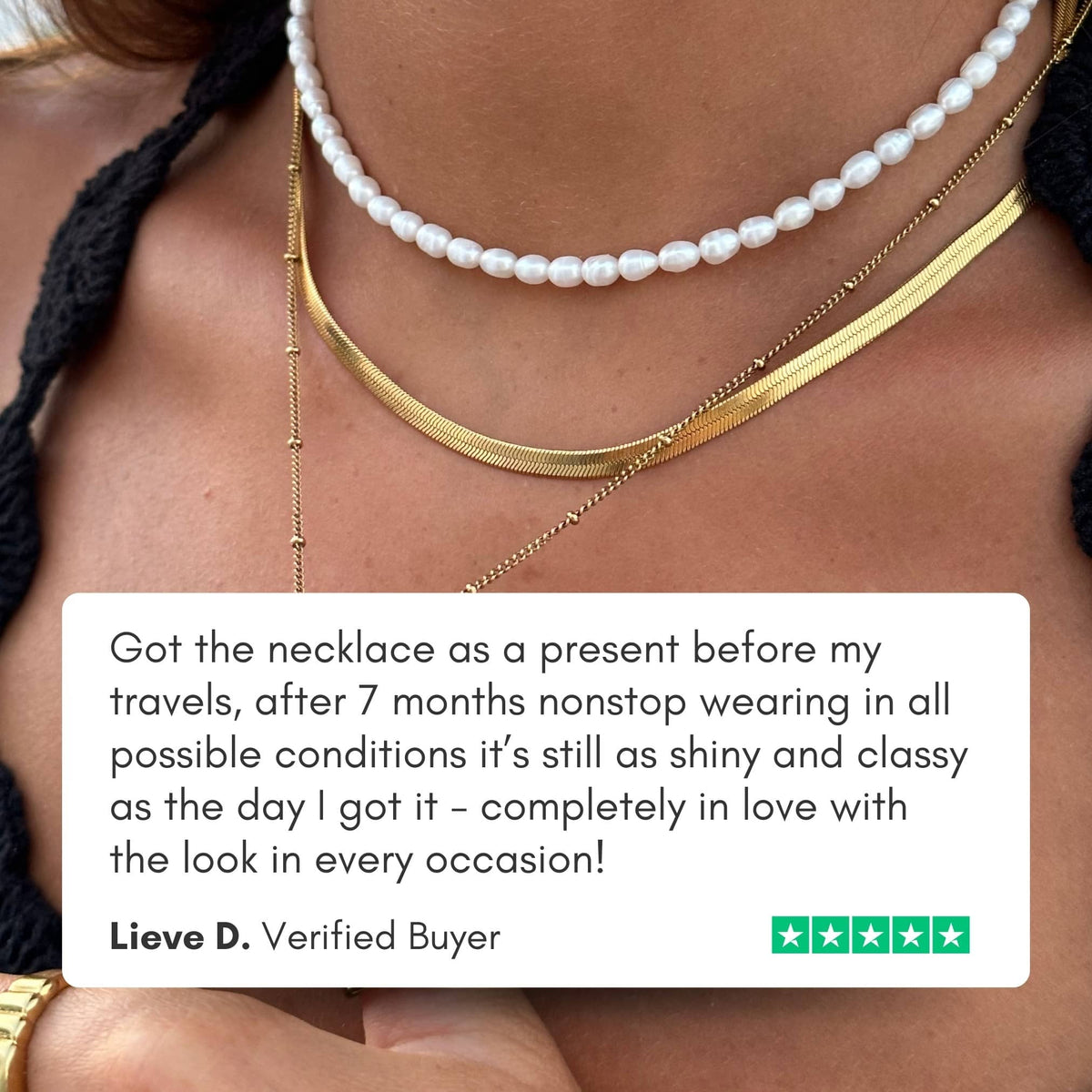 Gold herringbone choker layered with a pearl necklace, with a 5-star customer review