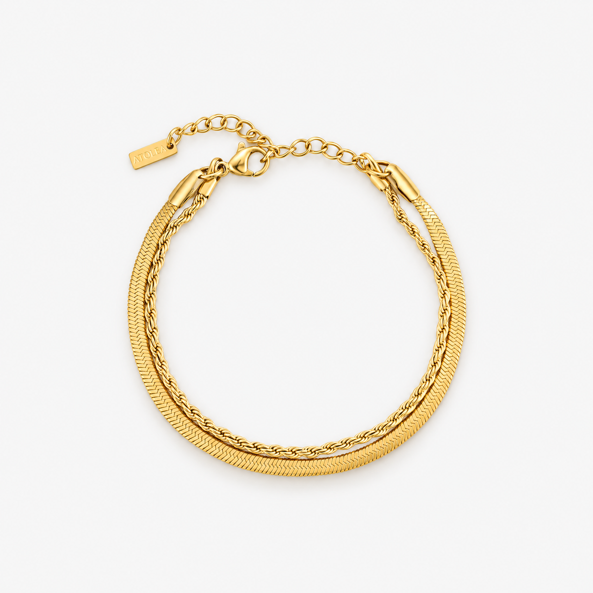 Ios layered gold bracelet with two chains on a white background